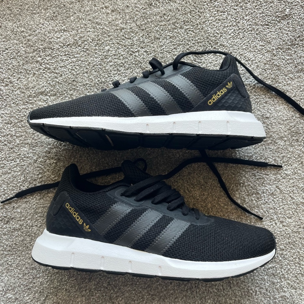 Women’s adidas athletic shoes, black fabric, black stripes and gold writing, 8.